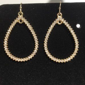 Gold hoop earrings with diamond like stones